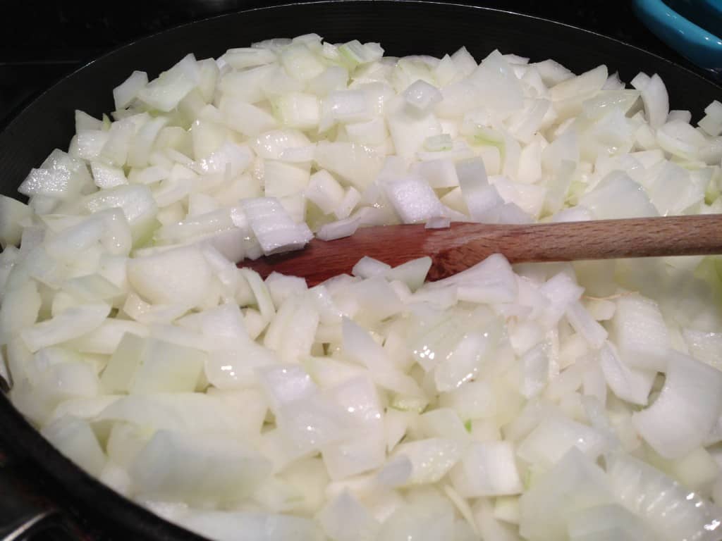 Onions in skillet, ready to cook down
