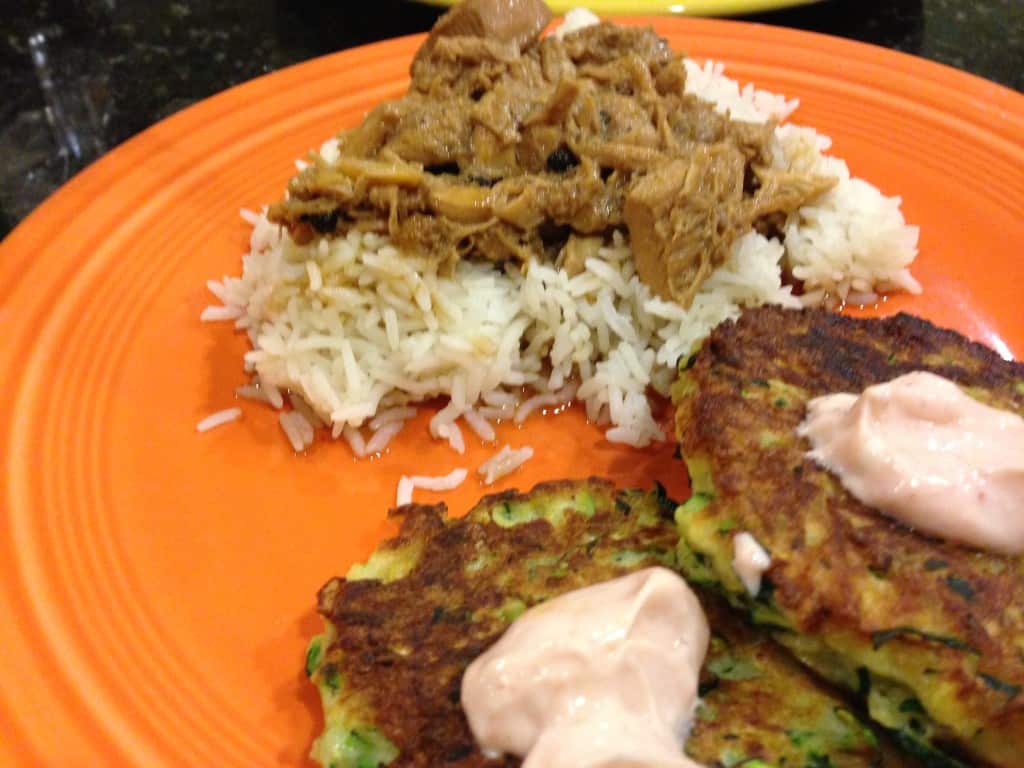 Chicken adobo with a side of zucchini fritters.