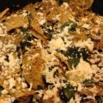 Chilaquiles with cheese, spinach, and chicken.