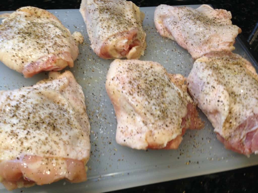 Chicken seasoned with salt and pepper.