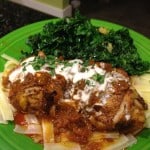 Chicken Paprikash over gluten-free noodles. On the side is a kale salad.