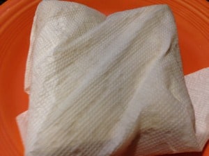 Damp paper towel around gluten-free burritos.